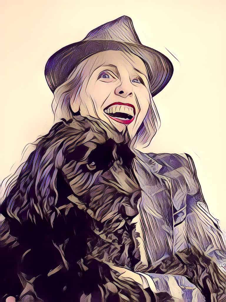 Anne met hoed op en assistentiehond Sophie in haar armen